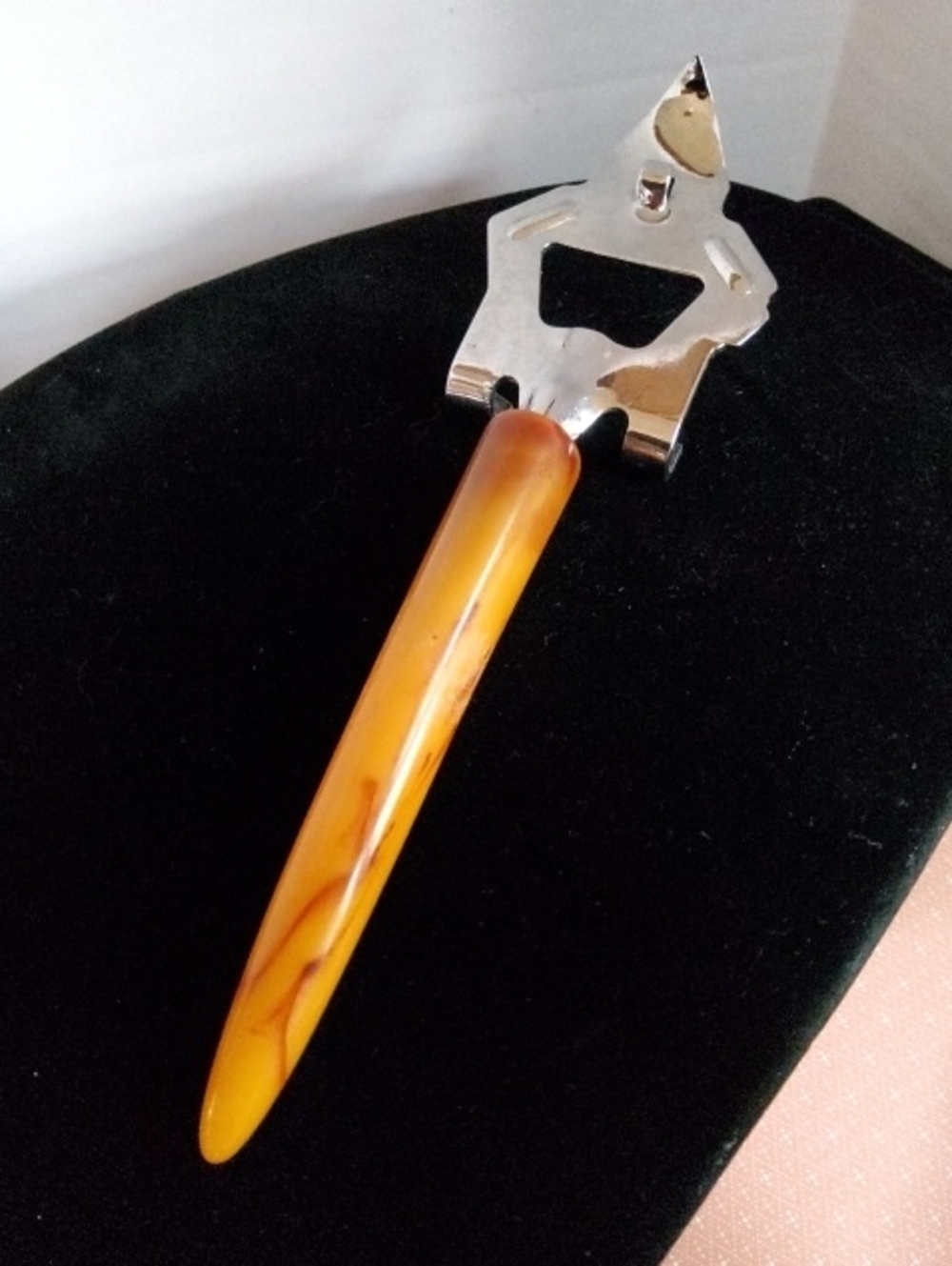 Vintage bottle/can opener marbled Bakelite.